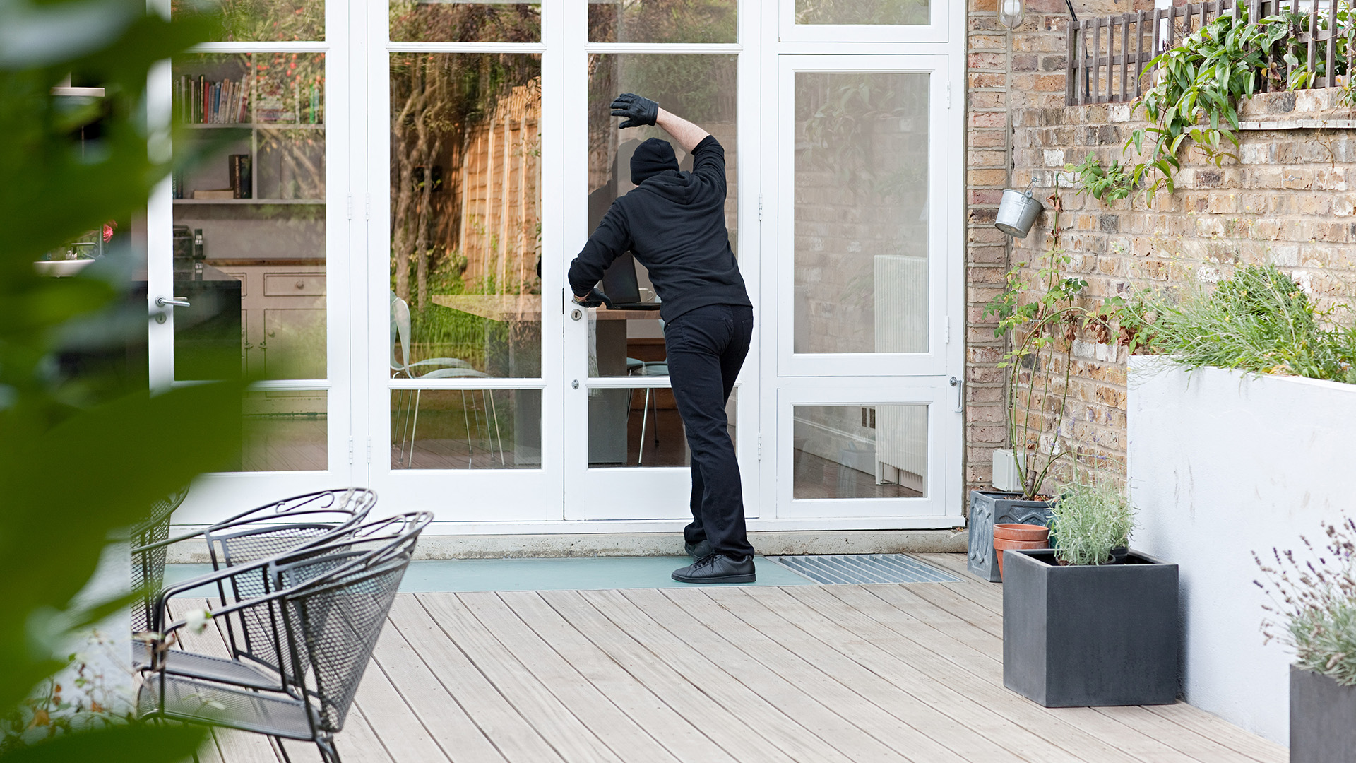 Burglar Attempting Break-in | CPI Security Blog