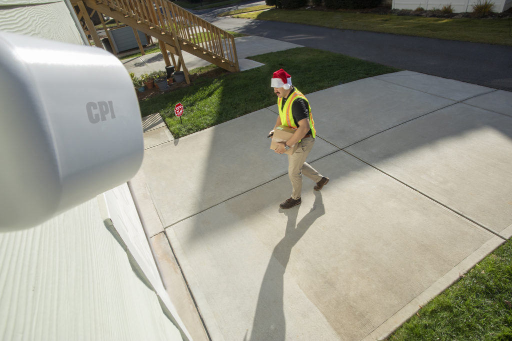 delivery person dropping package off in garage