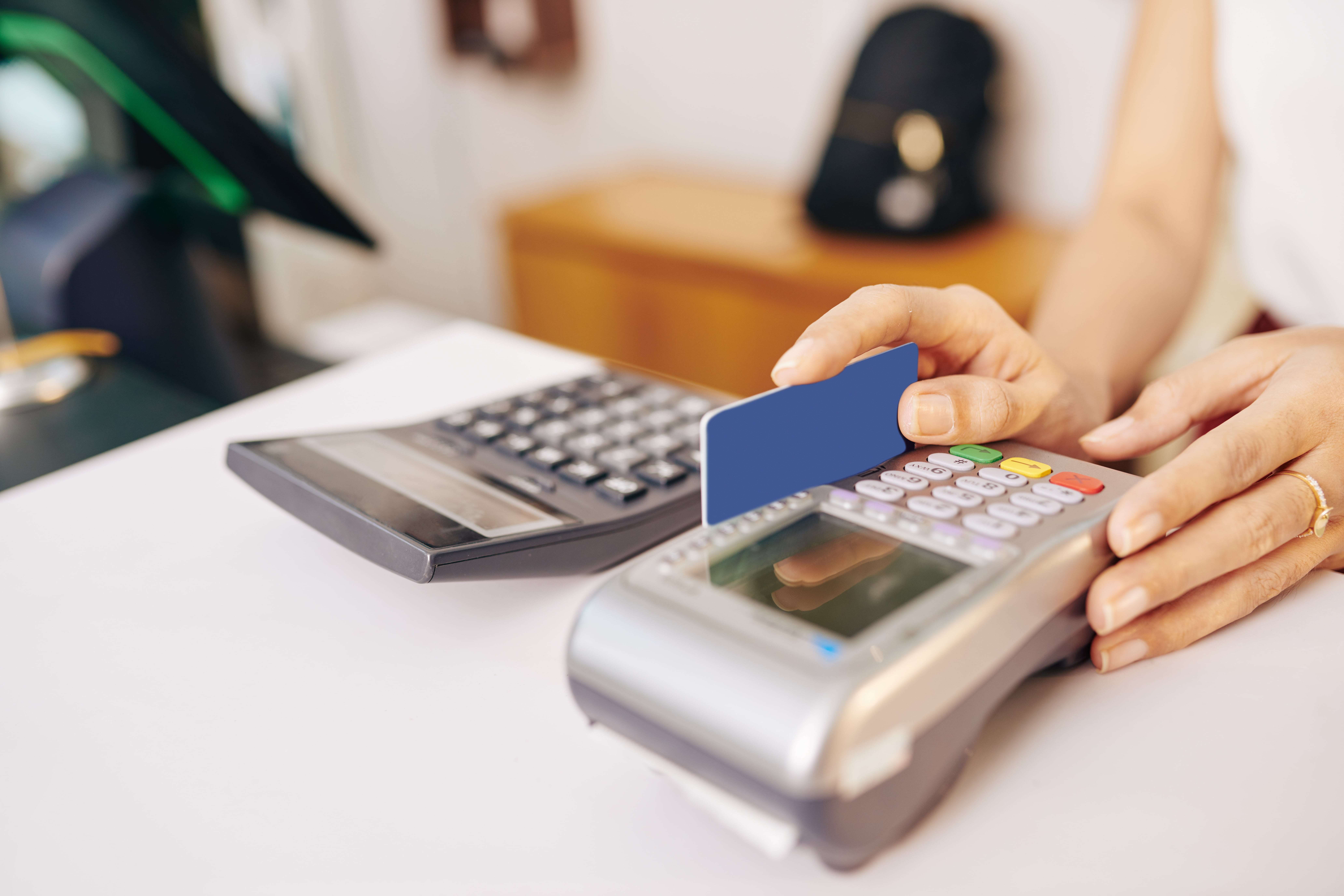 Cashier Swiping Credit Card